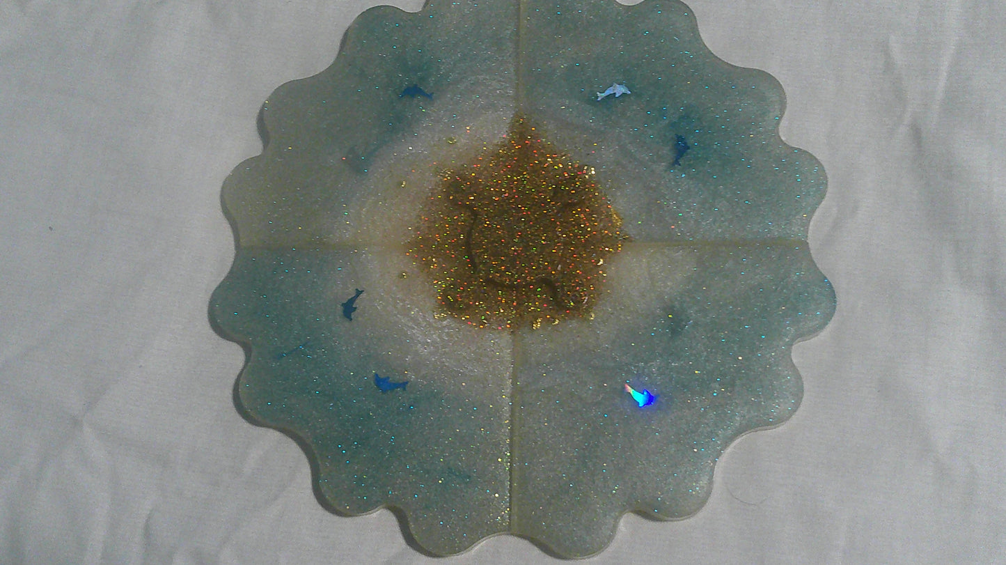 Dolphin puzzle coaster assembled - ocean blue with gold glitter centre