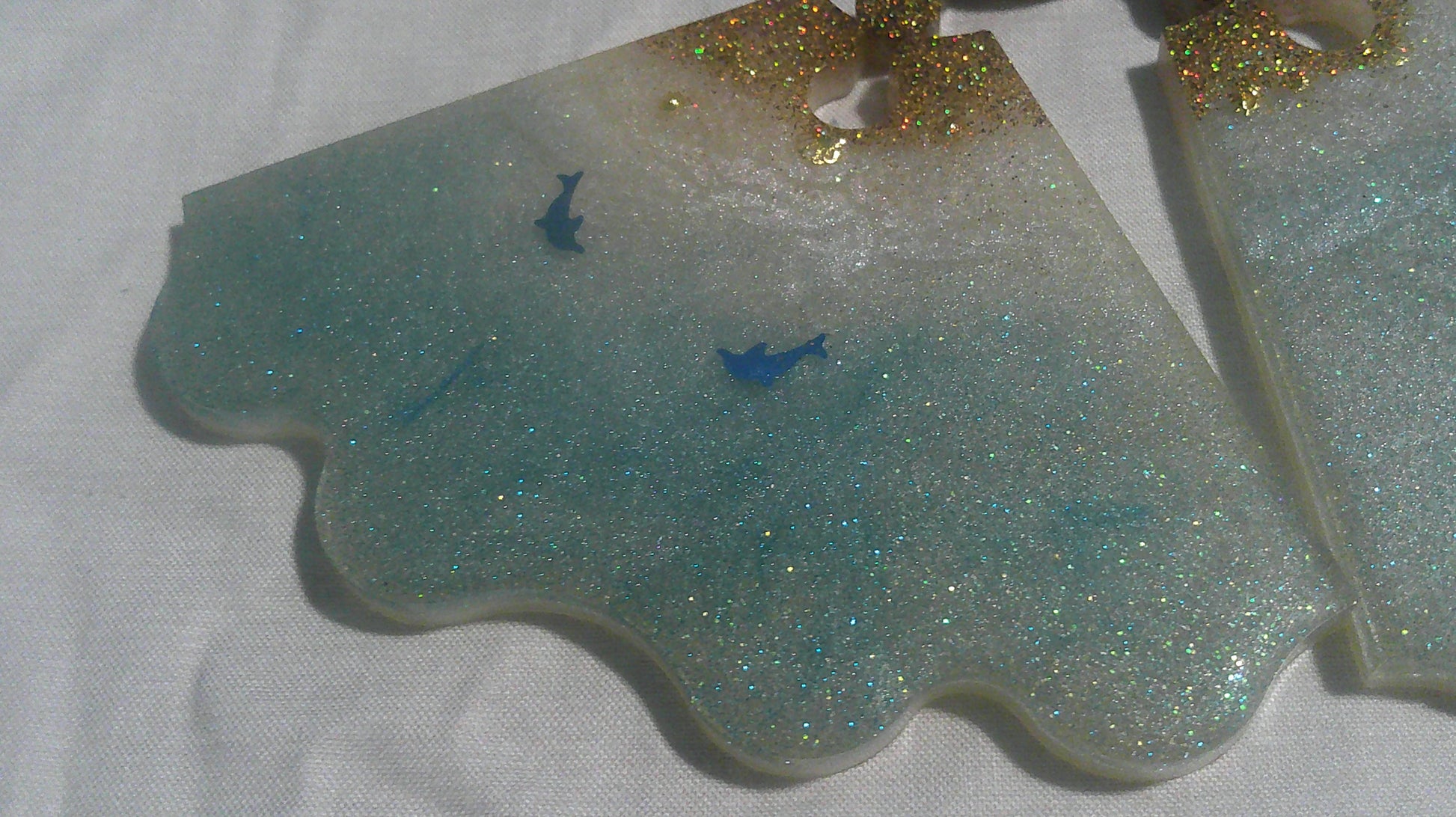 Dolphin puzzle coaster individual piece close up