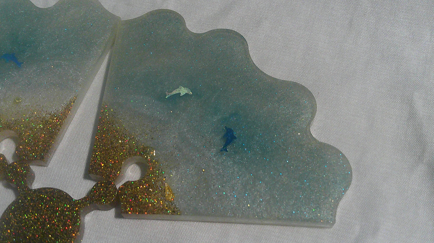 Dolphin puzzle coaster pieces apart - top view
