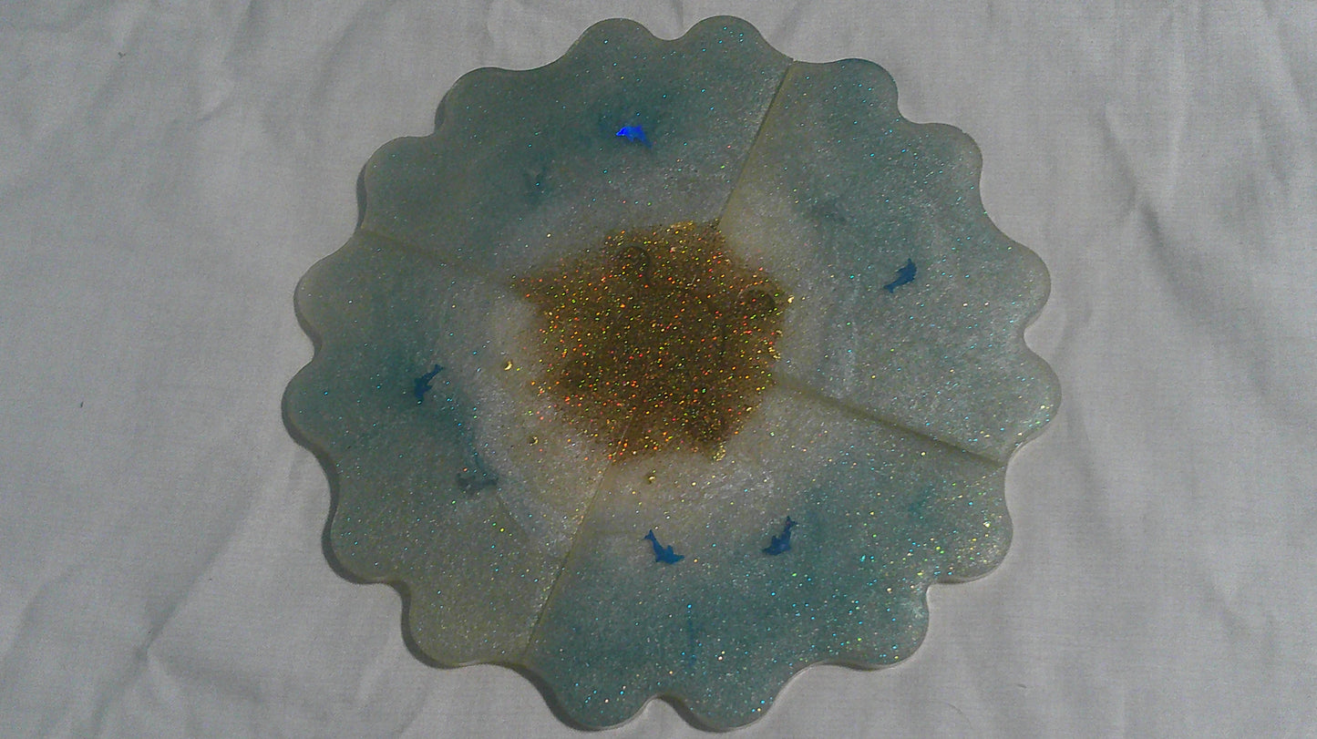 Dolphin puzzle coaster pieces apart - angle view